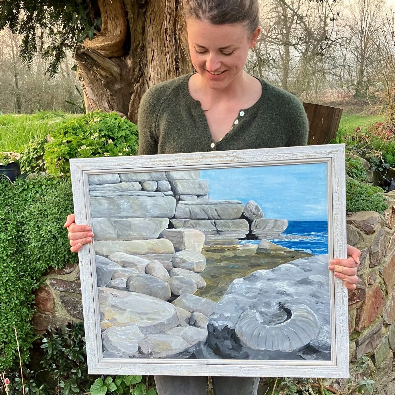 Artist holding Winspit painting